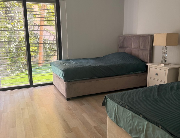 Modern 2-Bedroom Ground Floor Apartment with Garden & Pool in Abdoun near Australian Embassy