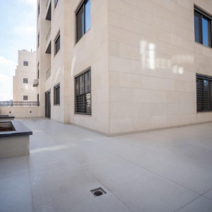 Spacious 2-Bedroom Apartment for Rent in Deir Ghbar – Ground Floor with Terrace, Parking & Elevator